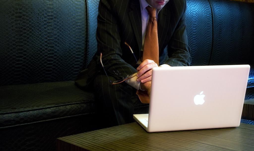Hotel Lopez De Haro Bilbao Bagian luar foto A man using a laptop